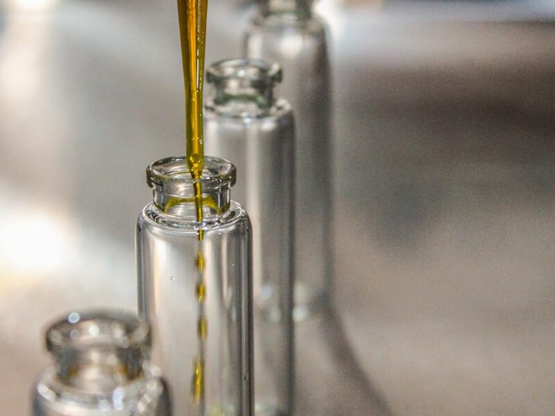 Extraction Products clear glass bottle with yellow liquid